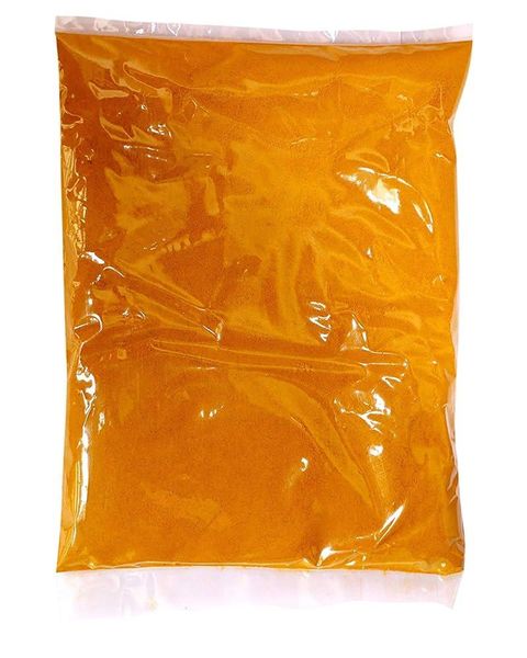 High-quality turmeric powder in a glass jar