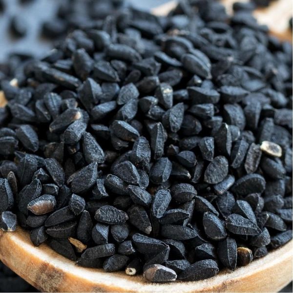 Fresh nigella seeds in natural packaging