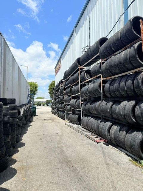 Used truck tires arranged in warehouse for sale