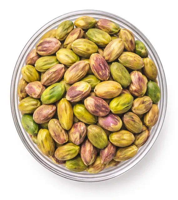 Handful of natural green pistachio kernels