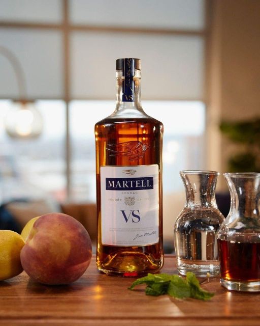 Martell VS Cognac bottle displayed alongside glasses