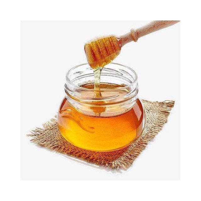 Natural Honey with Beehive Background