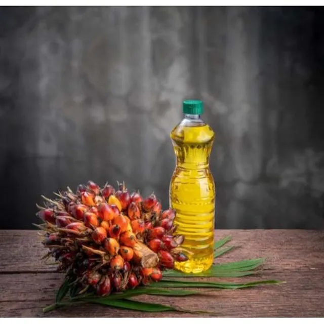 FENICIA branded palm kernel oil containers stacked