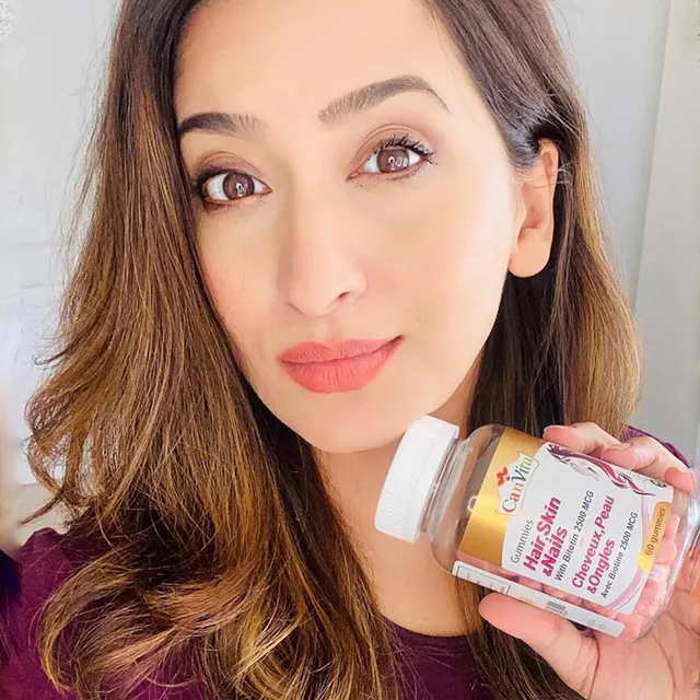 Canvita gummy vitamins displayed with natural ingredients