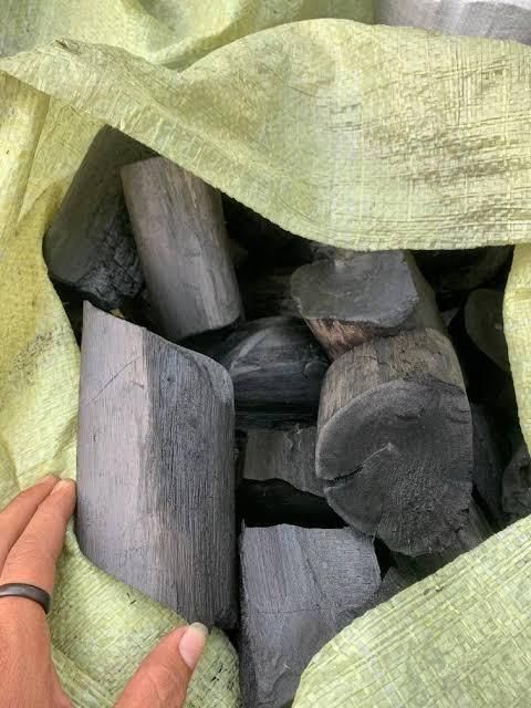 Hardwood charcoal stacked in bags