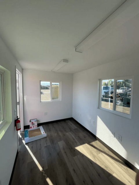 Interior setup of 20ft refurbished office container with desks
