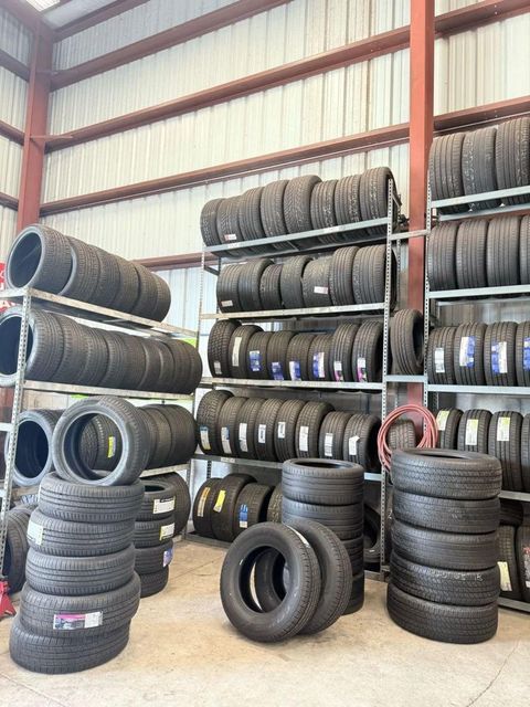 New tires lot stored in warehouse racks