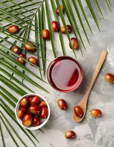 Large canisters of red palm oil