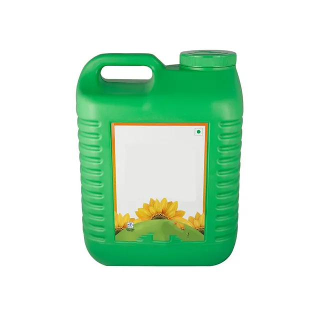 Close-up of refined sunflower oil pouring into a container