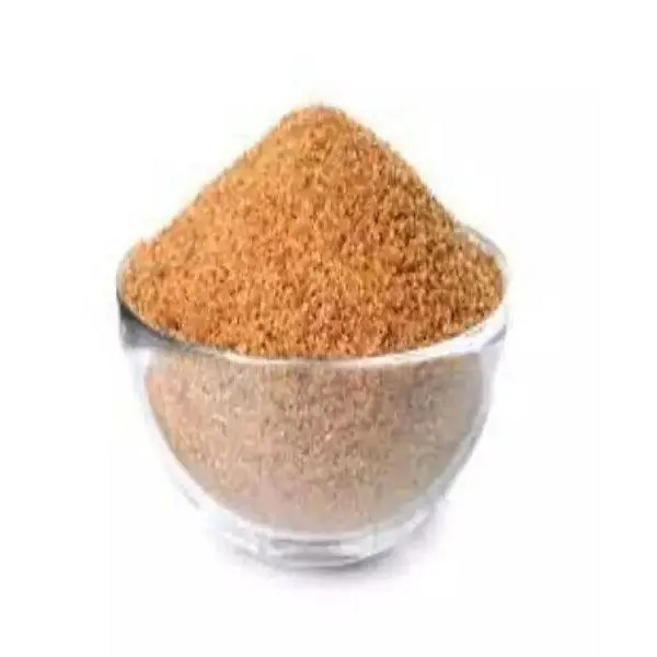 Bulk sacks of brown granular sugar stacked