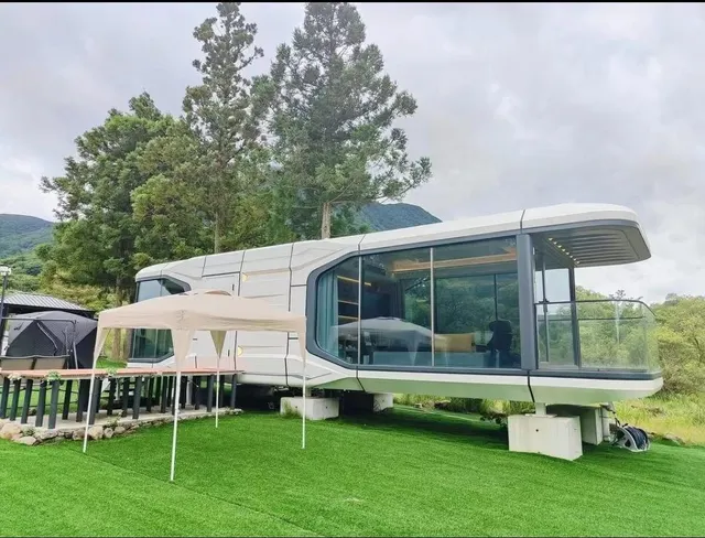 Modern interior of prefabricated modular glass pod home