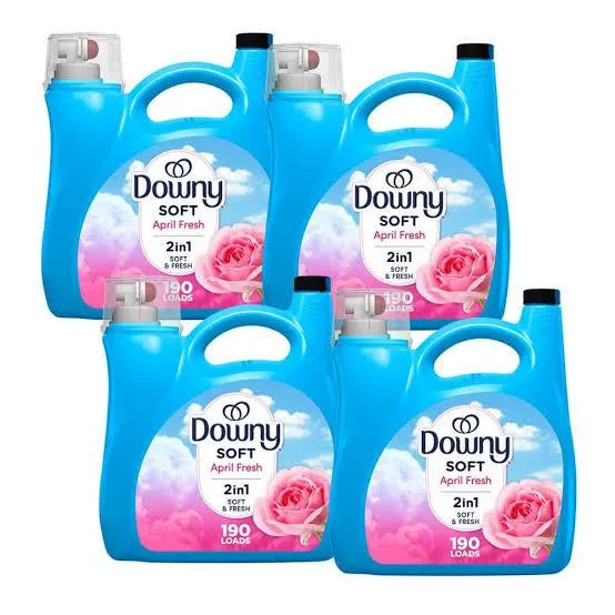 Downy fabric softener arranged with laundry items