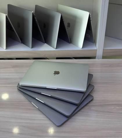 MacBook laptop open, showing screen and keyboard