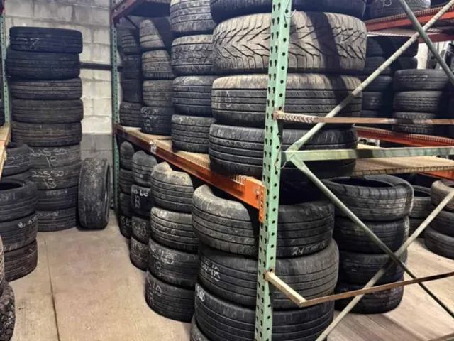 Used tires arranged in warehouse
