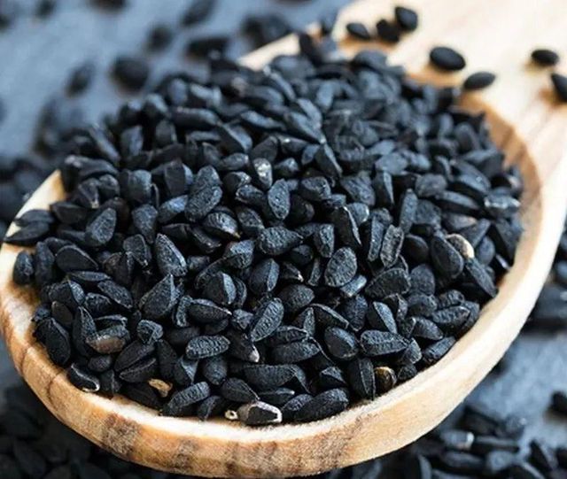 Black Cumin Seeds spread out on surface