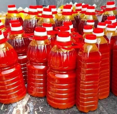 Bottle of red palm oil product