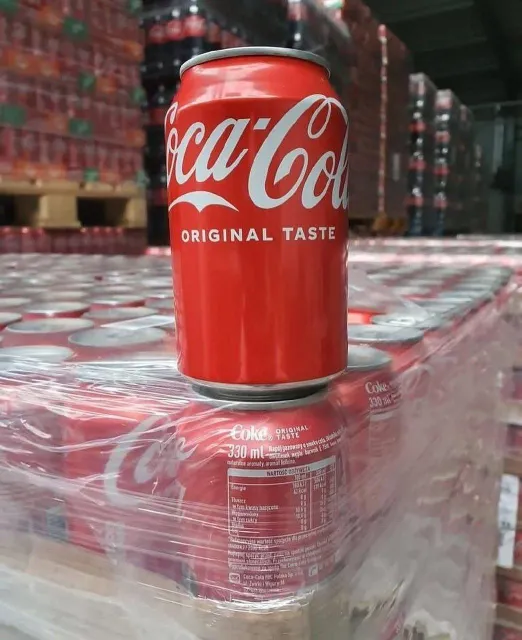 Coca-Cola Original Taste cans displayed together