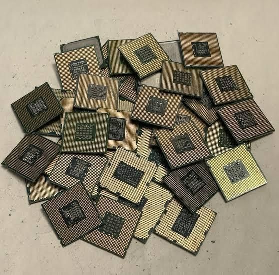 Bulk scrap motherboards stacked for gold recovery