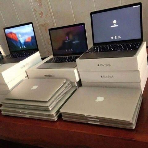 MacBook laptop showing multiple angles and backlit keyboard