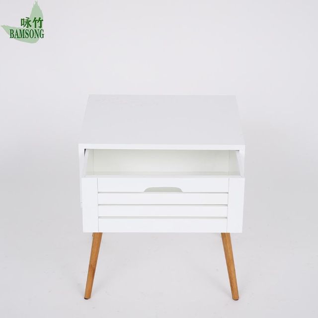 Bedroom bedside table in Nordic style with decorative accents