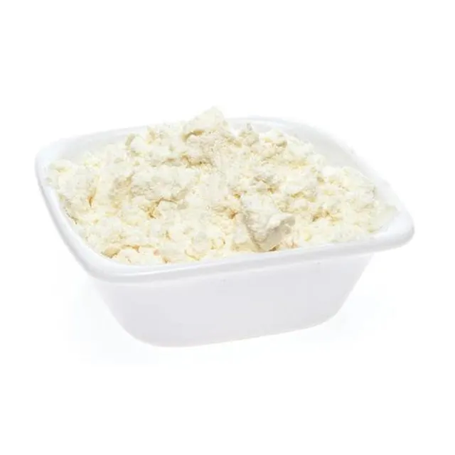 Spoon scooping Full Cream Instant Milk Powder
