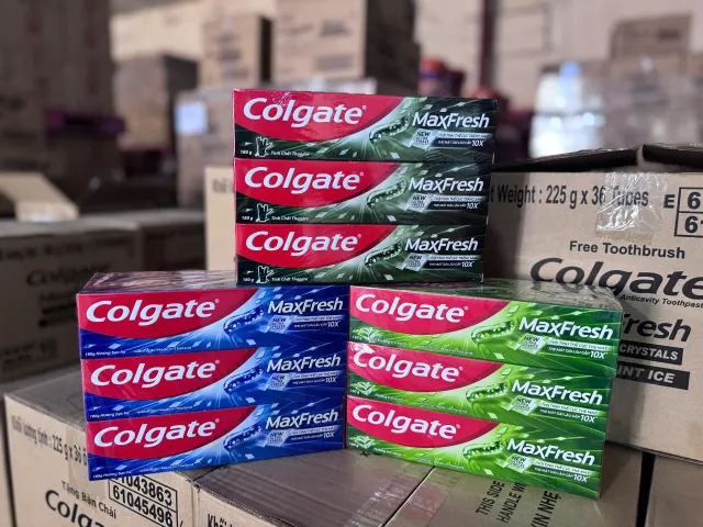 Colgate Maxfresh toothpaste tube and cap close-up